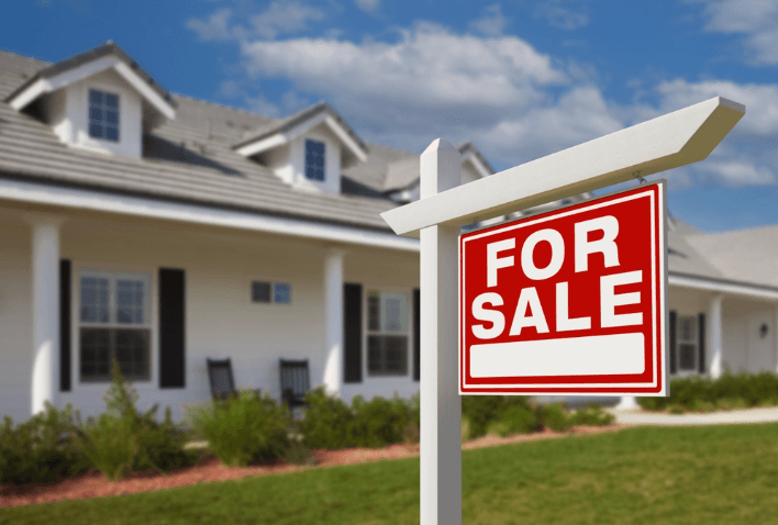 A home with a For Sale sign