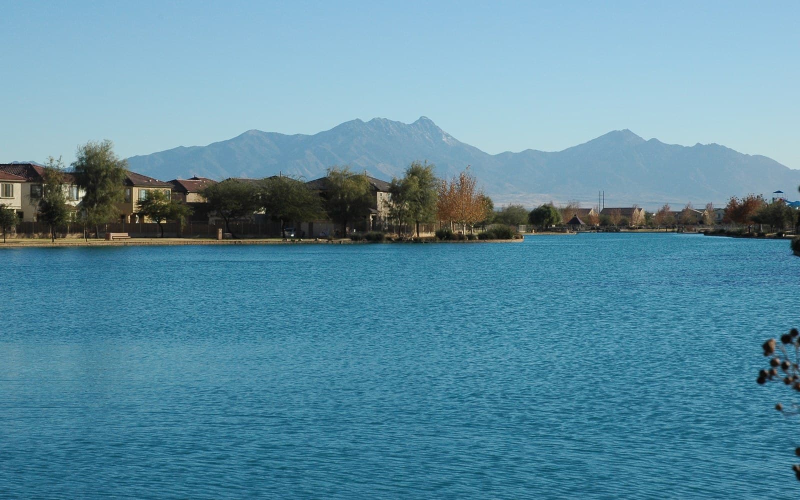 Sahuarita Lake with homes and the Santa Rita Mountains beyond